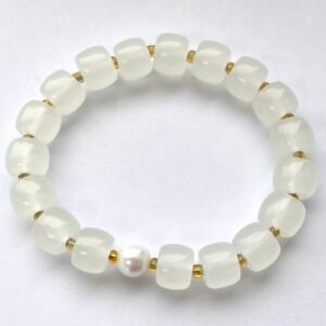 A Pearl In The Palm Of The Ocean: White quartz bracelet with a pearl